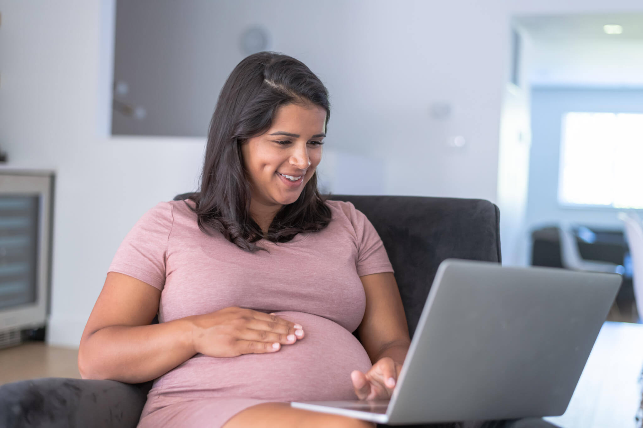 Ethnic Pregnant Woman Working From Home